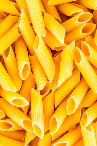 istock A close up of yellow pasta with a grainy texture 2151699072