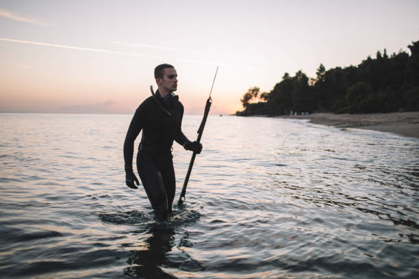Spearfisherman getting out of the water