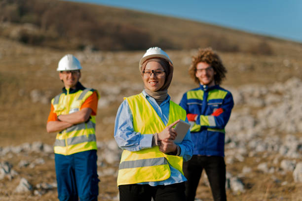 istock A team of engineers and workers oversees a wind turbine project at a modern wind farm, working together to ensure the efficient generation of renewable energy 2151701761
