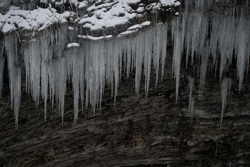 Looking down into a gorge where icicles hang at the state park