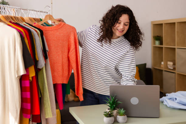 istock Woman working from home choosing clothes 2151706540