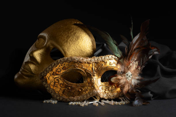 istock Golden Venetian carnival masks on a black background. 2151710235