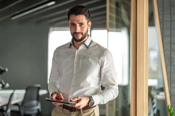 istock Professional Caucasian Businessman Using Tablet in Office Environment 2151713485