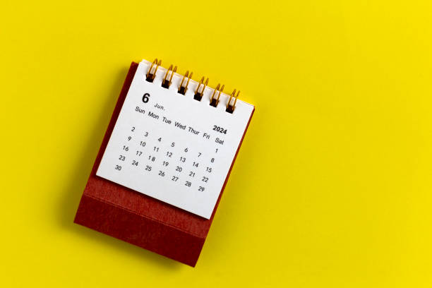 istock Desk calendar for June 2024 on a yellow background. 2151715604