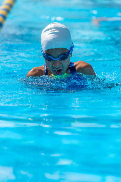 istock Self motivated young girl practicing swimming in the pool. 2151718979
