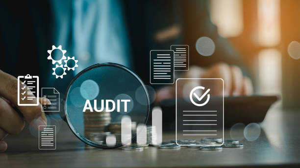 istock Audit business concept. Businessmen Using Magnifying Glass to check and evaluate financial statements. Auditing financial accounts within the organization. Audit And Fraud Investigation. 2151721702