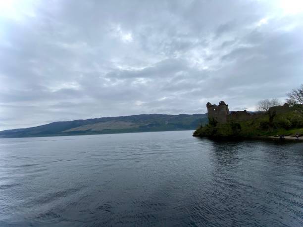 istock Loch ness from boat on cloudy day. castle ruins 2151721745