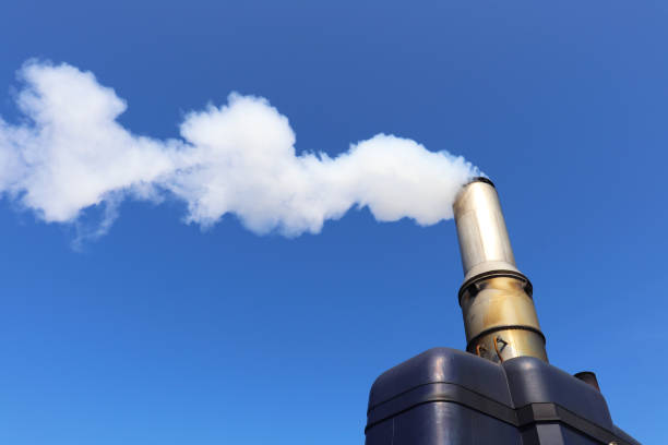 istock white smoke from a chimney against a blue sky 2151722683