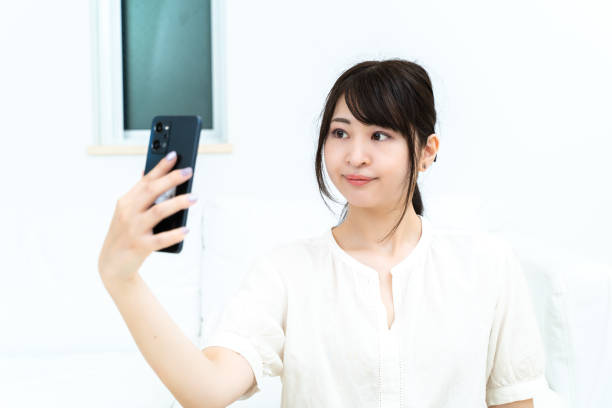 istock woman taking a selfie 2151723332