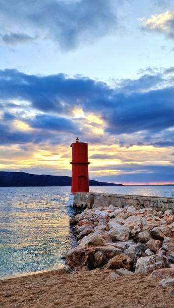 istock lighthouse and sundown - Cres Island 2151723566
