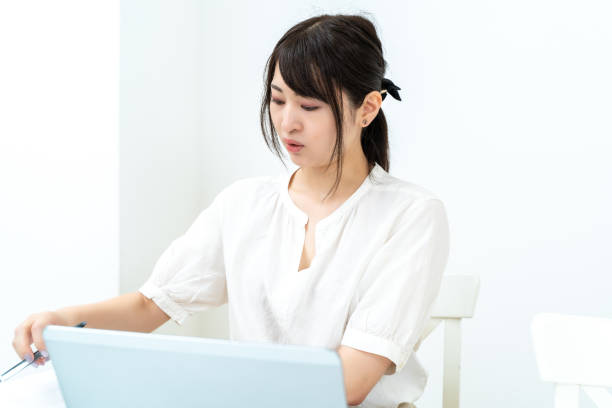 istock A woman keeping a household account book on a computer 2151723713