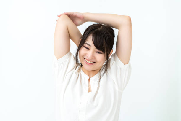 istock A woman stretching at home 2151723969