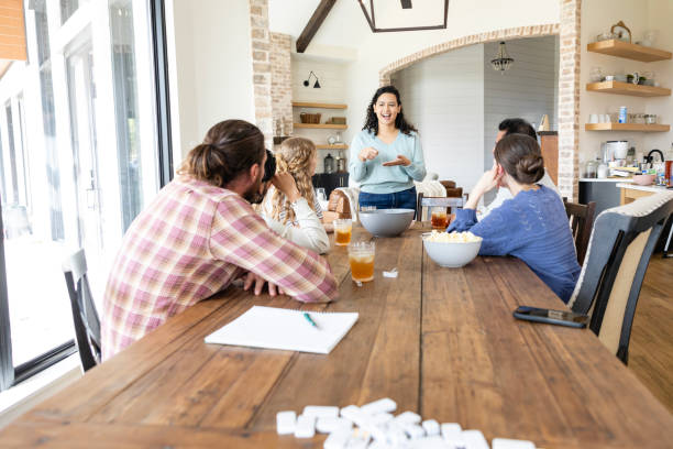 istock Unrecognizable group of millennials enjoy game night together 2151724716