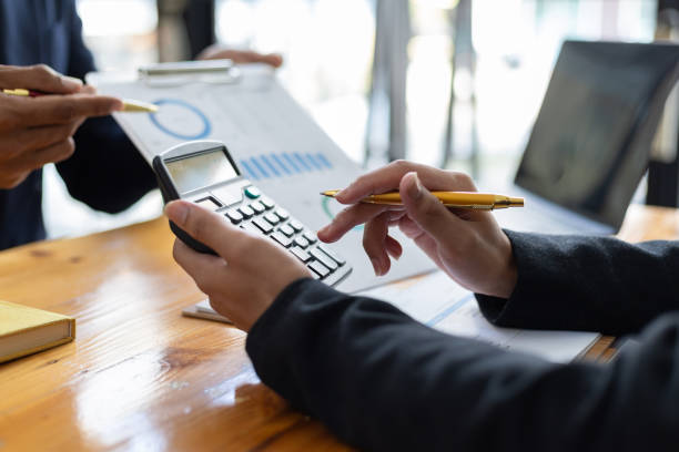 istock Financial advisor meeting is discussing data analysis, financial statistics, accounting and financial budget planning. 2151726974