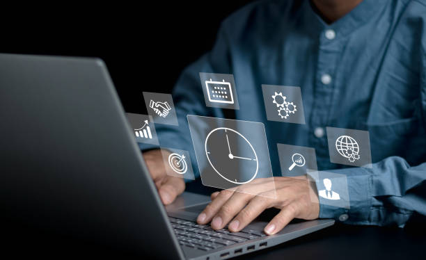 istock Time management concept. Businessman touching clock icon on virtual to work planning for increases efficiency and reduces work time. Business project planning. 2151728537