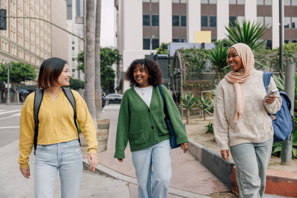 istock Three female students walking in downtown after school 2151729538
