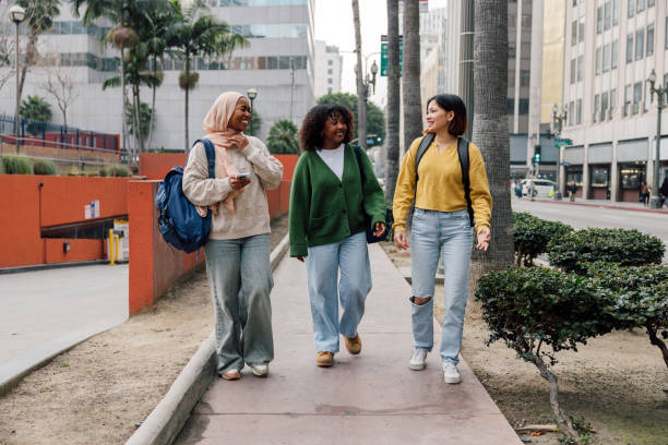 istock Three female students walking in downtown after school 2151729586