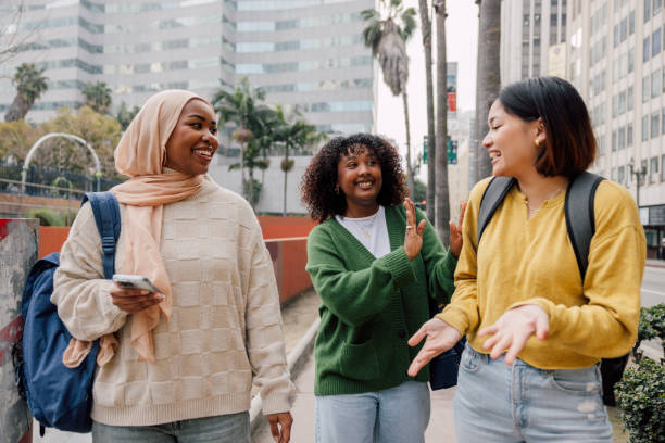 istock Three female students walking in downtown after school 2151729667