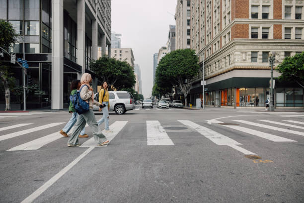 istock Three female students walking in downtown after school 2151729827