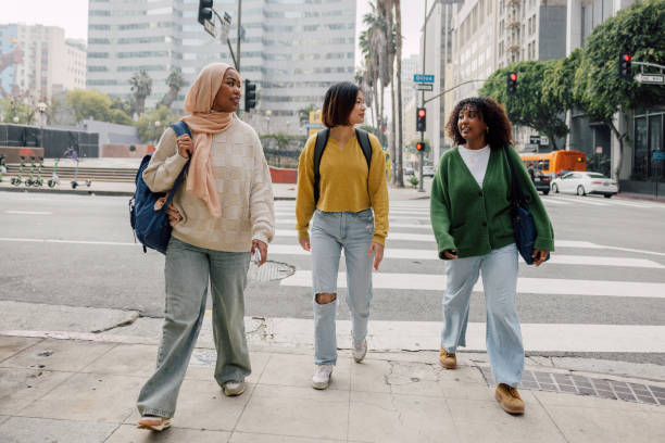 istock Three female students walking in downtown after school 2151729887