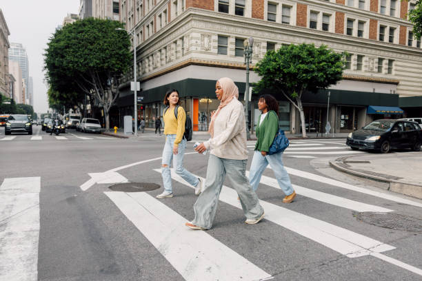 istock Three female students walking in downtown after school 2151729973