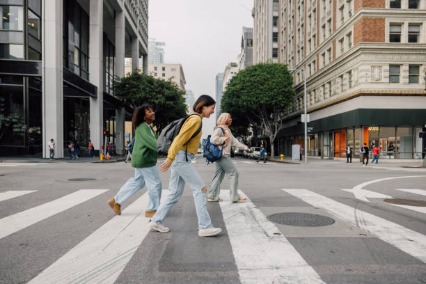 istock Three female students walking in downtown after school 2151730035