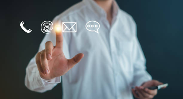 istock Businessman  touching on virtual screen with the email,  address, call phone, Chat message icons. Customer support hotline Contact us people connection. 2151730462