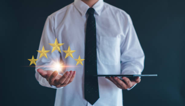 istock Customer service experience and business satisfaction survey, close up  hand using smart phone and give five star symbol to increase rating of product and service concept. 2151730499