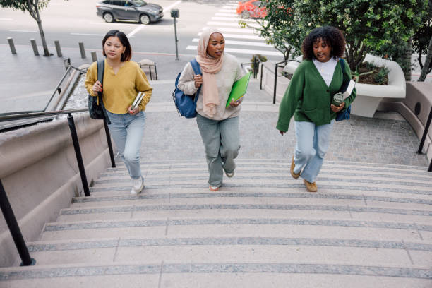 istock Three teenage students walking up University staircase 2151732092