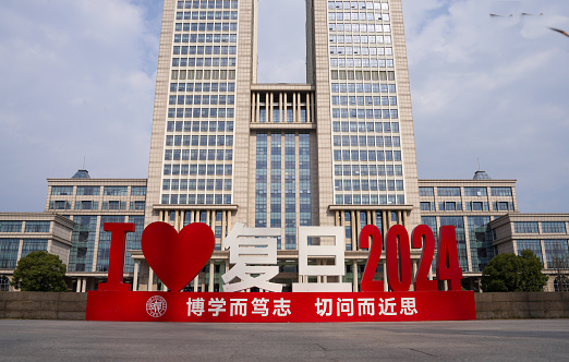 Shenzhen, China -February 17 , 2024:Fudan University's new education building and sculpture in front