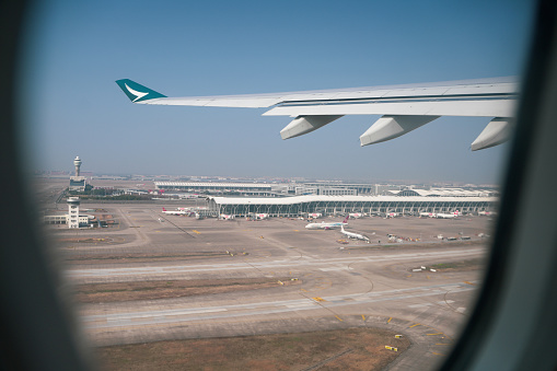 Shenzhen, China -February 18 , 2024:A Cathay Pacific Airways plane leaves the airport at Shanghai Pudong International Airport in China