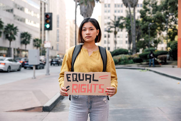 istock Young woman student on strike marching for equal rights 2151734015