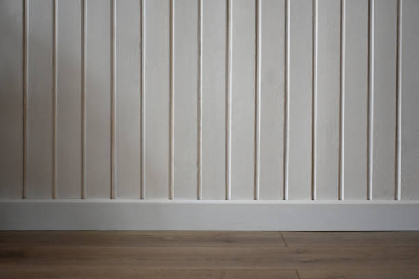 istock White wood wall and brown wood flooring 2151736621
