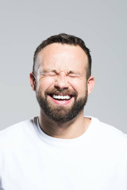istock Headshot of happy bearded young man, grey background 2151737042