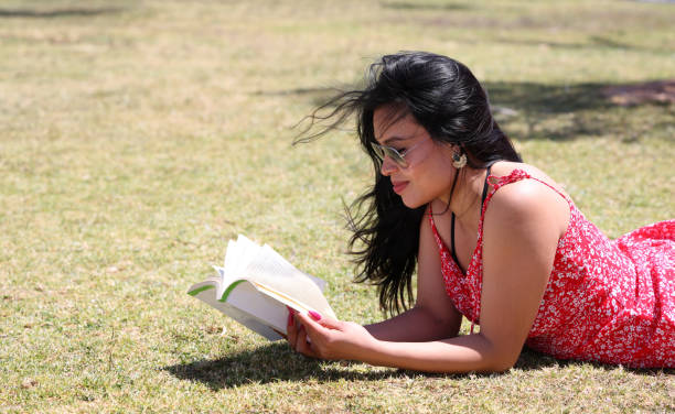 Student studying and having fun day out on summers day