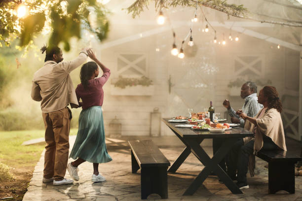 istock Happy black couples having fun on a party in the backyard. 2151740198