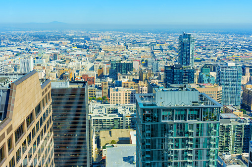 Buildings of downtown Los Angeles in exquisite detail from an elevated vantage point. Dynamic energy of downtown LA.