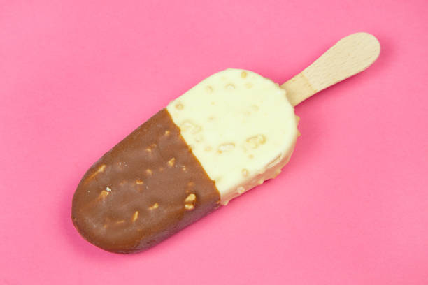 Chocolate and vanilla ice cream bar on pink background