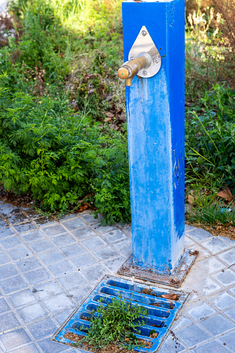Closed Water Faucet Symbolizing Drought Restrictions. It is relevant because it represents the measures taken during drought and water restrictions imposed to conserve this vital resource.
