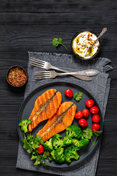 istock grilled salmon steaks with broccoli and tomatoes 2151751205