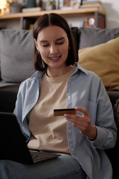 istock Young smiling woman with credit card 2151751912