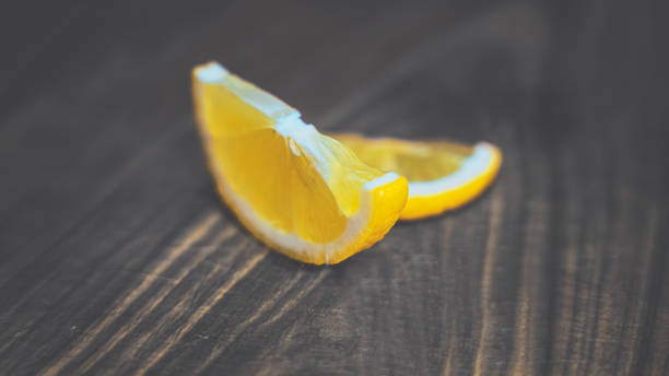 istock Two lemon slices on a wooden board. 16-9 POSTER 2151752961