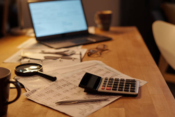 istock Calculator and pen on financial bills 2151756056