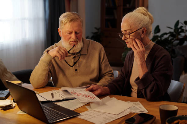 istock Senior couple looking at unpaid bill 2151756067