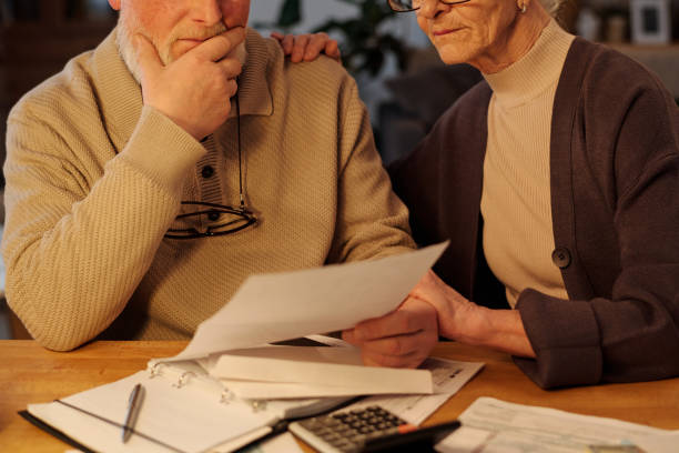 istock Seniors looking at unpaid financial bill 2151756106