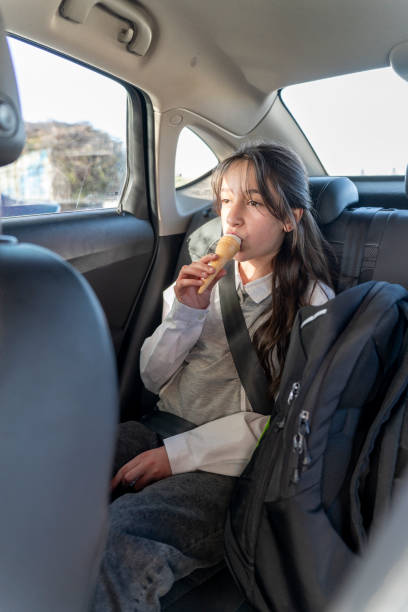 istock A girl eating ice cream. 2151756623