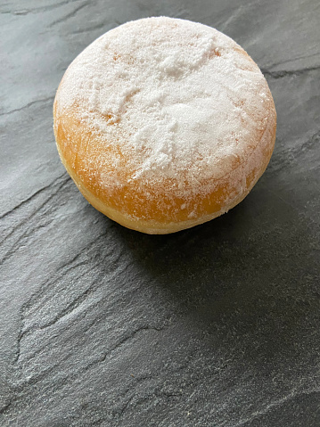 Berliner doughnut on table with copy space. German pastry doughnut