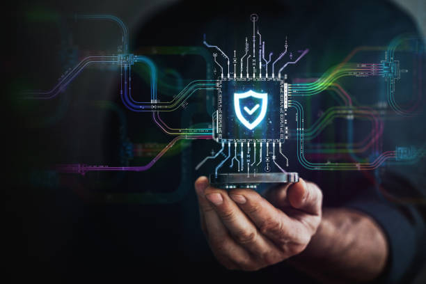 istock Security in your hand. A hand holds digital shield icon in the center and circuit board with vibrant data transfers, representing evolving security technology of the future. 2151760990