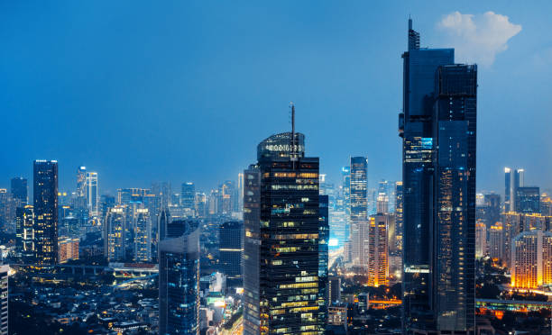 View at night, Jakarta business district, Indonesia Aerial view of a stunning sunset over Jakarta business district in Indonesia capital city. Jakarta is Southeast Asia largest city and a fast growing. jakarta stock pictures, royalty-free photos & images