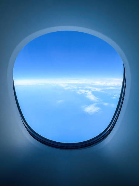 istock White clouds over blue Atlantic ocean seen through an airplane window 2151763190